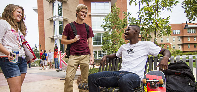 Students siting by the courtyard 