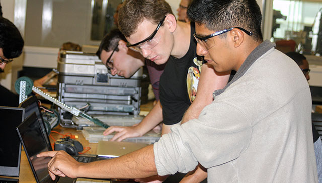 KSU students working on a robot